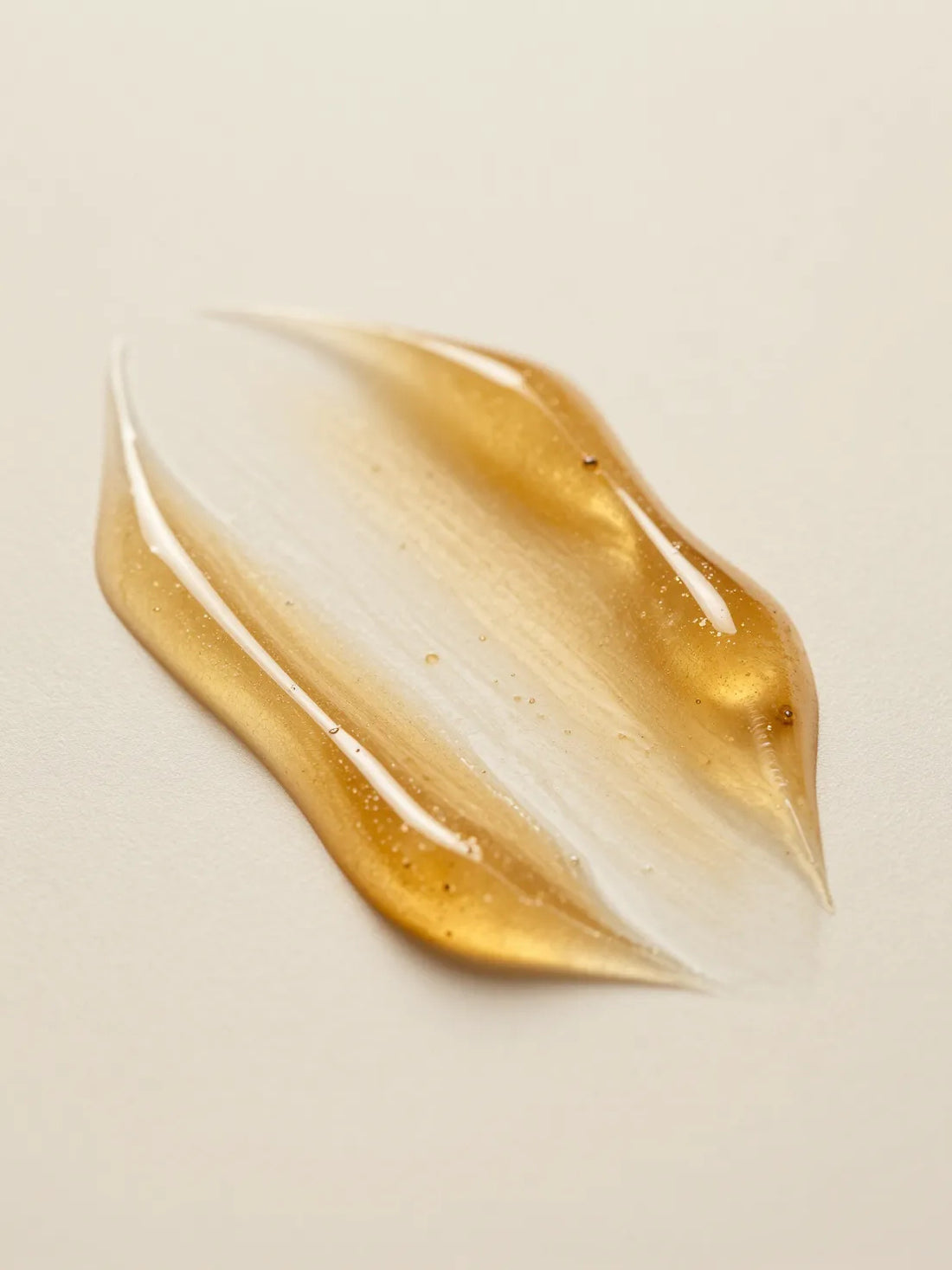 CELLULAR ANTI-AGING GINKGO BOOSTER, the texture of golden water-gel in close macro