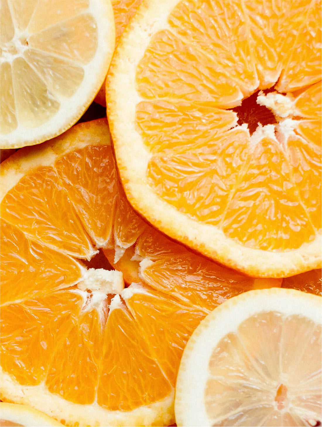 Halved oranges and a lemon slice in close macro, KOJIC ACID FACE CREAM
