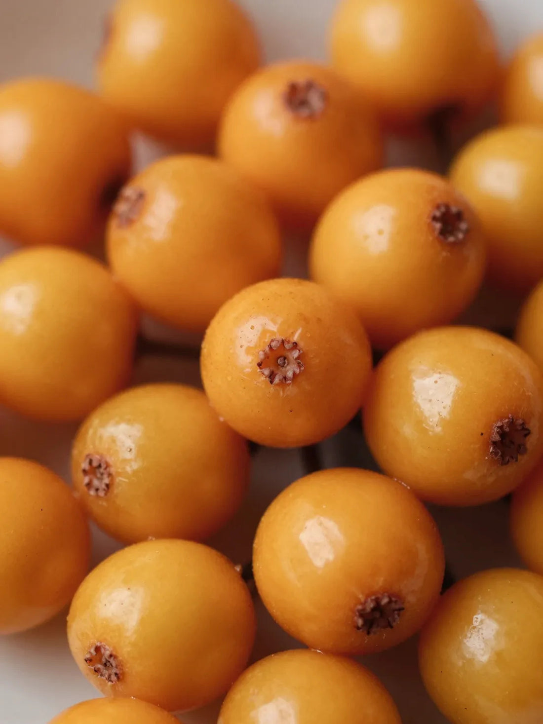 Whole Sea Buckthorn fruit, close botanical macro, natural skin and colour variation, 1% KOJIC ACID SPOT TREATMENT
