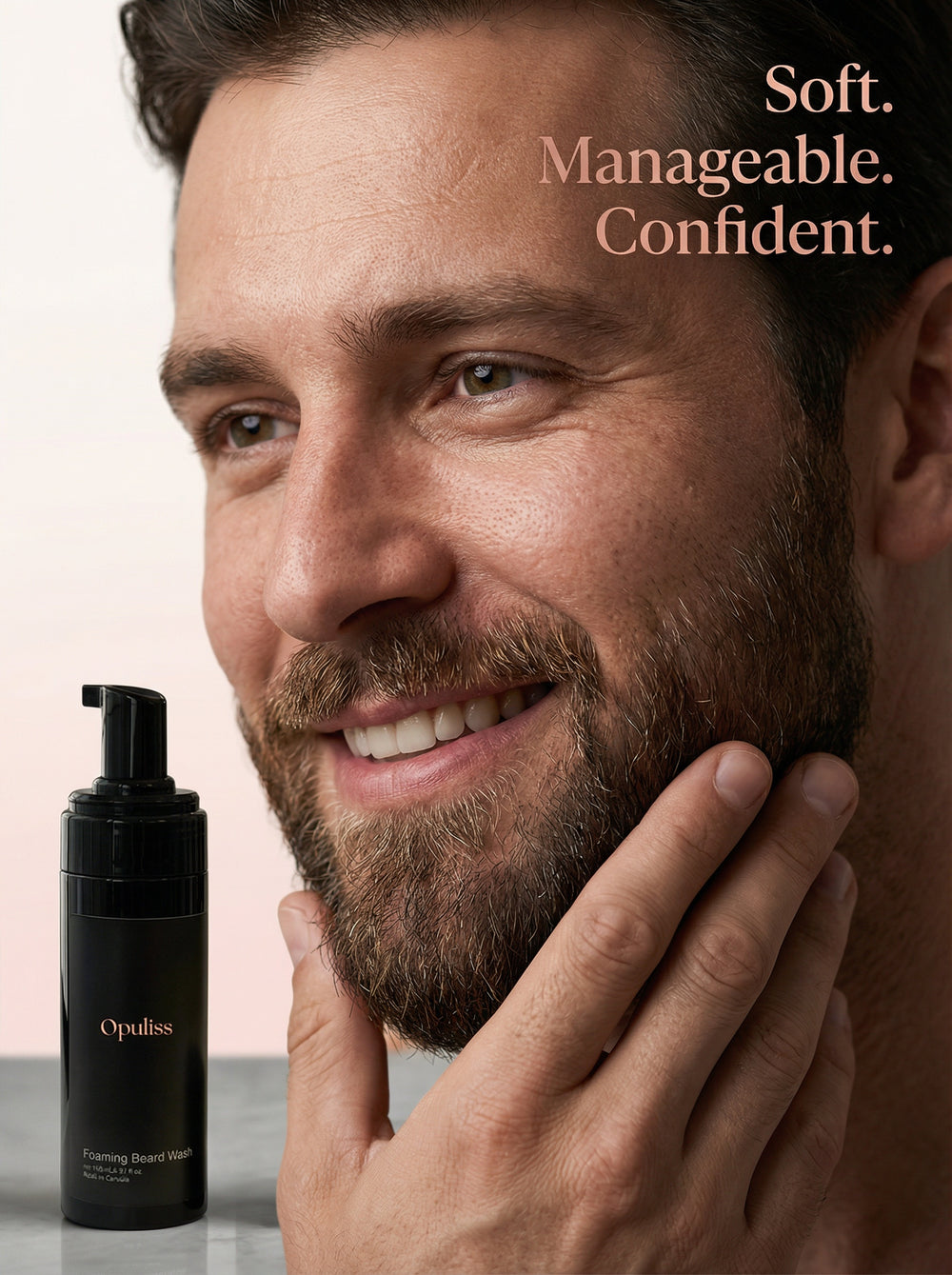 Opuliss foaming beard wash bottle on a light pink background