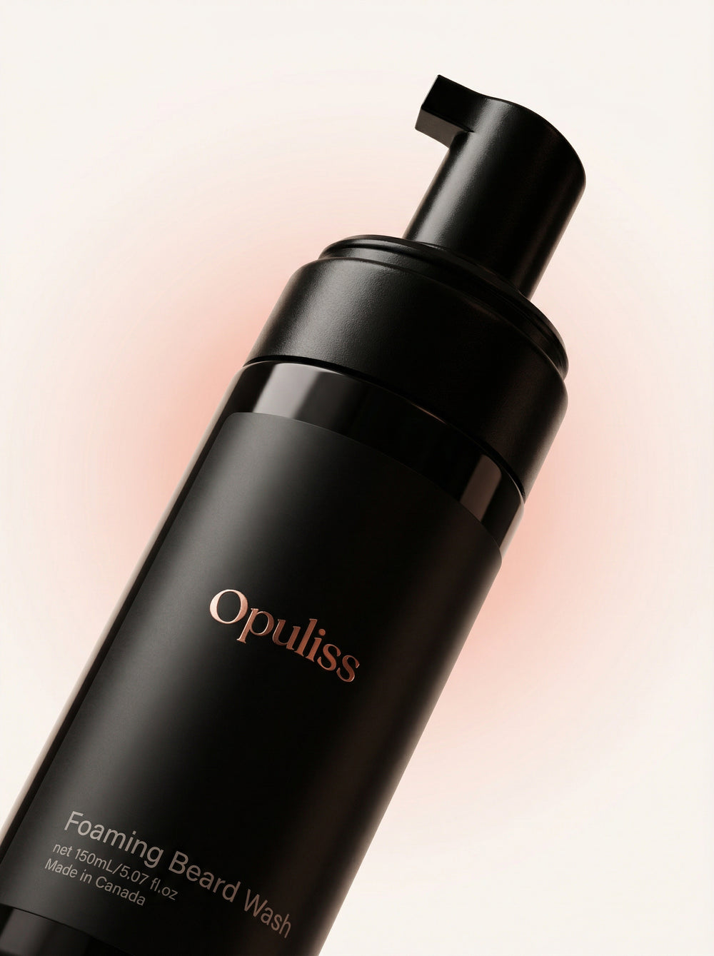 Opuliss foaming beard wash bottle on a light pink background