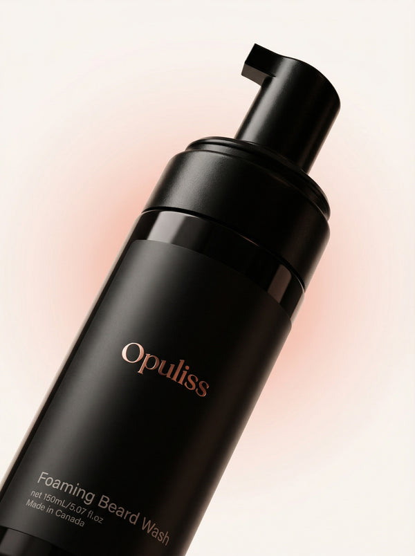 Opuliss foaming beard wash bottle on a light pink background