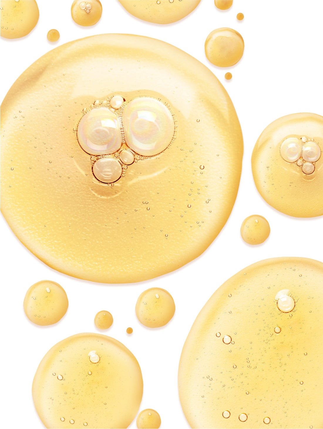 Golden oil droplets pooled and overlapping, CELLULAR ANTI-AGING GINKGO BOOSTER