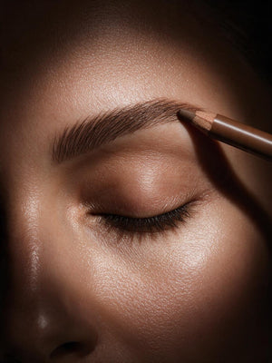 Eyebrow Pencil Brown Angled Dual Tip Spoolie For Natural Brows in warm medium brown, drawn through the eyebrow