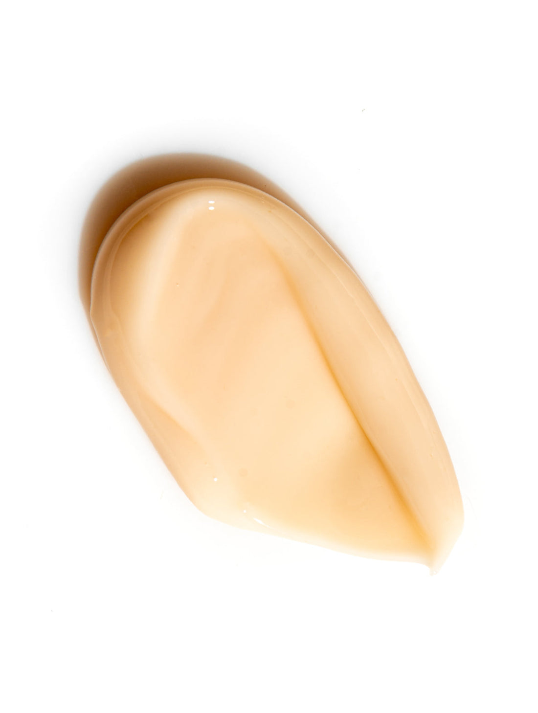 A swatch of peach cream on white, KOJIC ACID FACE CREAM