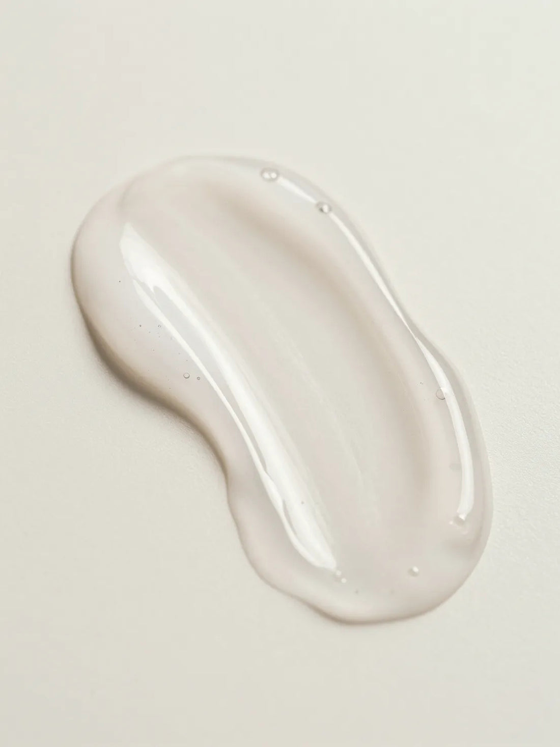 A clear hydrating gel photographed up close, its texture and transparency, ZINC PCA BALANCING GEL