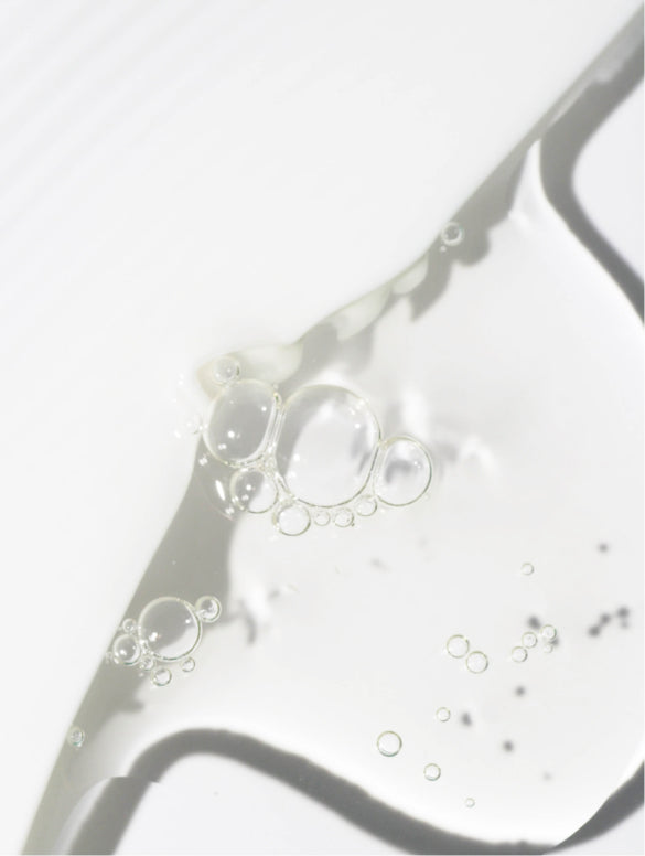 Clear gel drawn into a ribbon, ZINC PCA BALANCING GEL FOR MEN