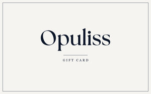 The reverse of the Opuliss gift card, the same face inverted, cream with the Opuliss wordmark in deep navy